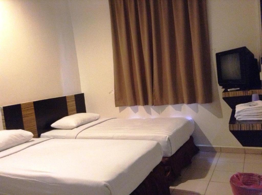 Hotel Traveller Кота-Кинабалу Номер фото